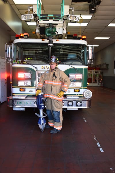 firefighter holding jaws-of-life