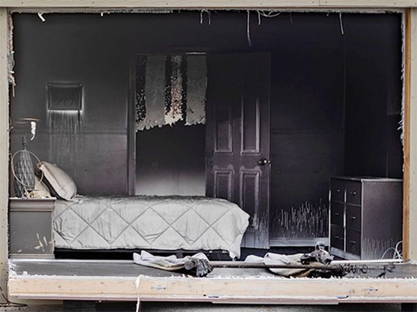 Photo of a bedroom after a fire with the door open