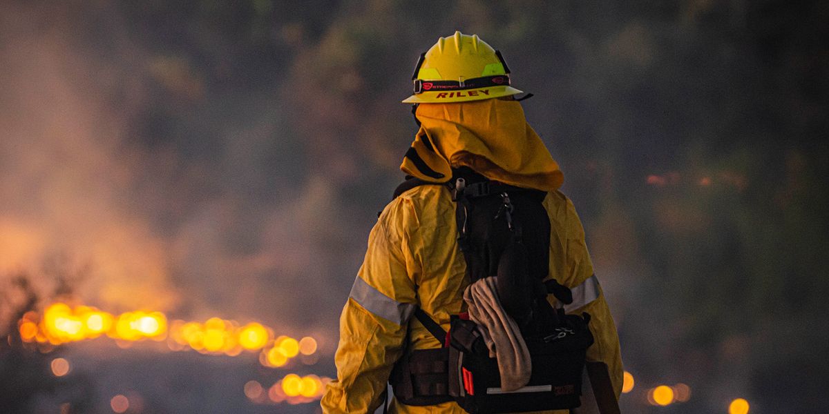 William Riley looks down to the brush fire at Sepulveda Basin on Thursday, Oct. 24, 2019, in Los Angeles, Calif. The fire started out earlier in the afternoon and has caused to burn 50 acres of land.(Photo by Kevin Lendio)