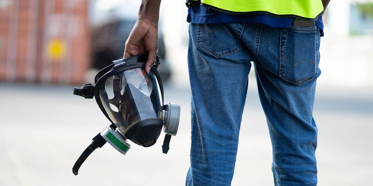 Person holding a respirator